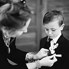 The ring bearer has his boutonniere pinned on