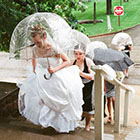 The bride and her bridesmaids ascend the stairs