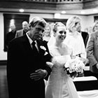 The father of the bride escorts his daughter up the aisle