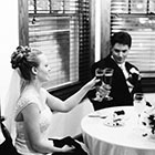 The Bride and Groom toast with champagne glasses