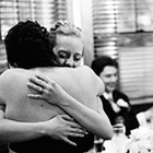 The Bride hugs one of her bridesmaids