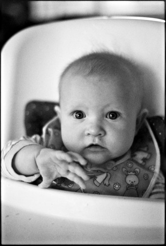 Portrait of a baby in a high chair
