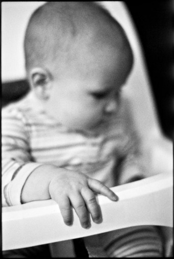Portrait of a baby in a high chair