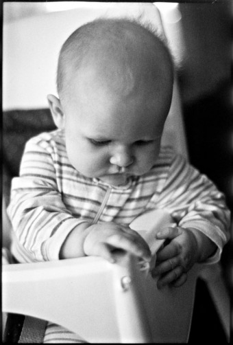Portrait of a baby in a high chair