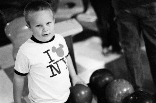 A five year old boy picks up his bowling ball