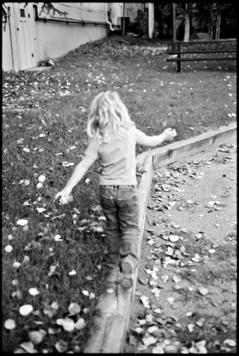 A little girl walks away from the camera