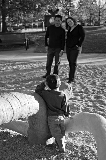 Three year old boy talking to his parents