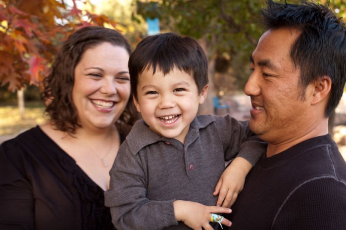 Portrait of a young family laughing