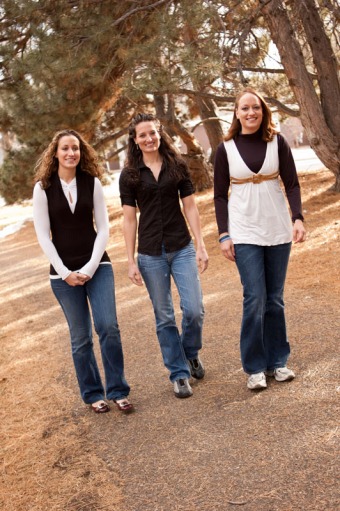 Three sisters smiling and walking