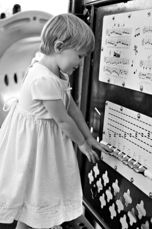 Three year old girl playing a