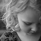 Portrait of a young girl looking down