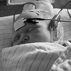 A newborn baby has her hearing tested