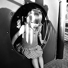 A toddler plays on the playground