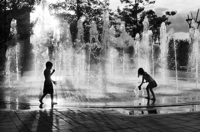 Kids playing in a fountain