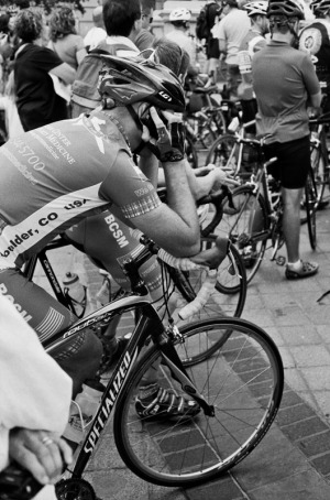 Cyclist at the state capitol on cell phone.