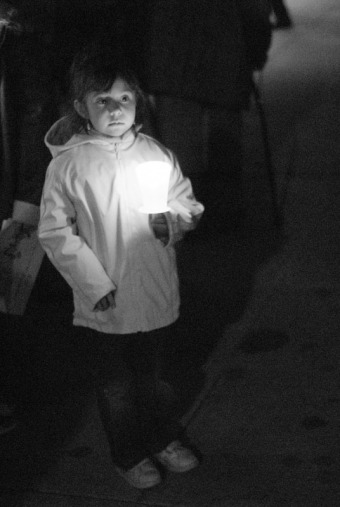 A little girl waits for the celebration to begin