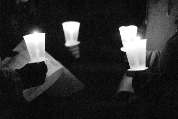 Members of the community hold their candles