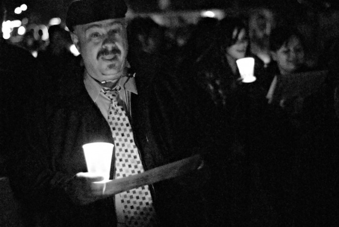 Choir Director Larry Meerdink walks and sings