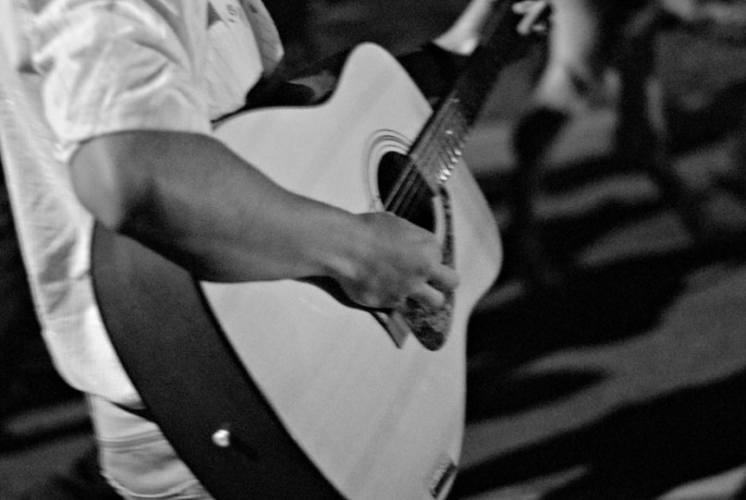 Students play guitars