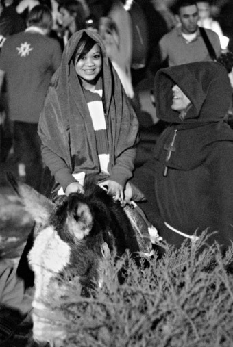 Two students play the parts of Mary and Joseph