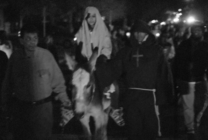 Two students play the parts of Mary and Joseph