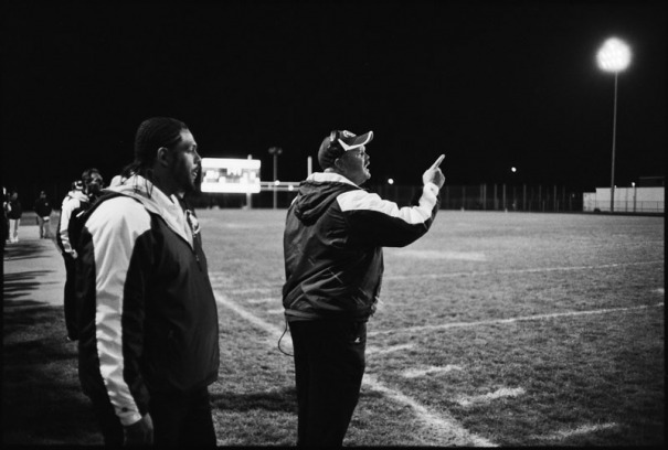 A coach shouts on to the field