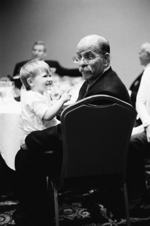 A two year old girl plays with her grandfather at a hotel reception the night before a Bat Mitzvah in Salt Lake City, Utah.