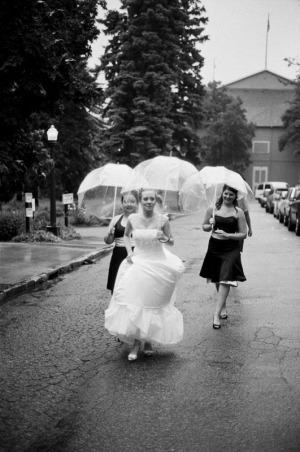 A bride and her bridesmaids walking up the street
