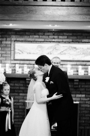 The bride and groom share their first kiss