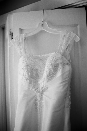 Wedding dress hangs over the closet door