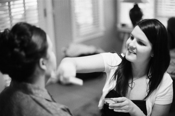 Bridesmaids applying make-up