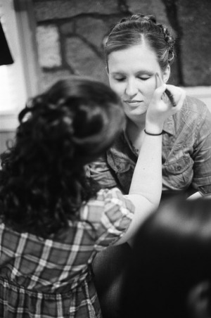 Bridesmaids applying make-up