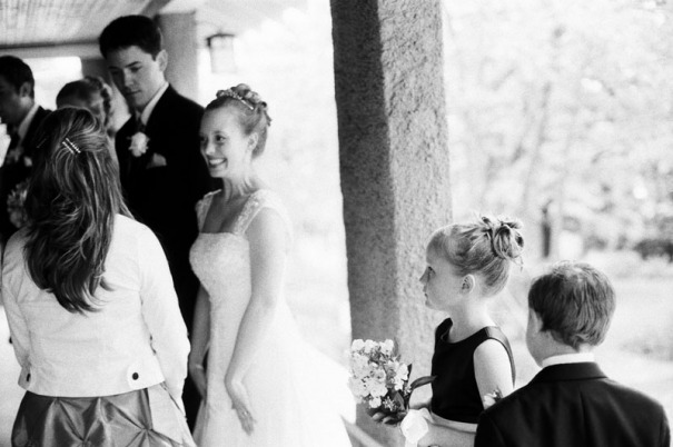 The flower girl looks on