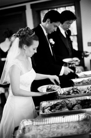 The Bride and Groom serve themselves dinner