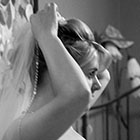 Bride adjusting her veil