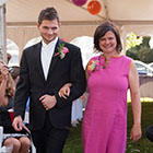 Mother of the bride escorted down the aisle