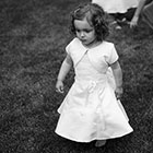 Flower Girl Walks on the Grass